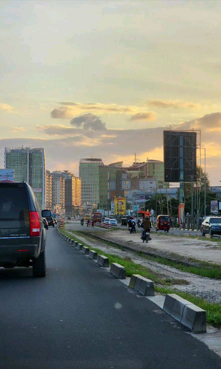 Dar es Salaam skyline at dusk along a city road