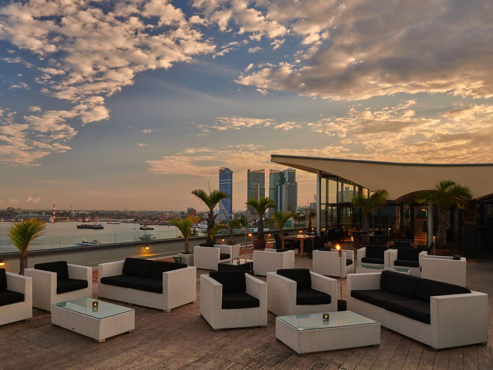 Rooftop lounge at sunset overlooking Dar es Salaam harbour