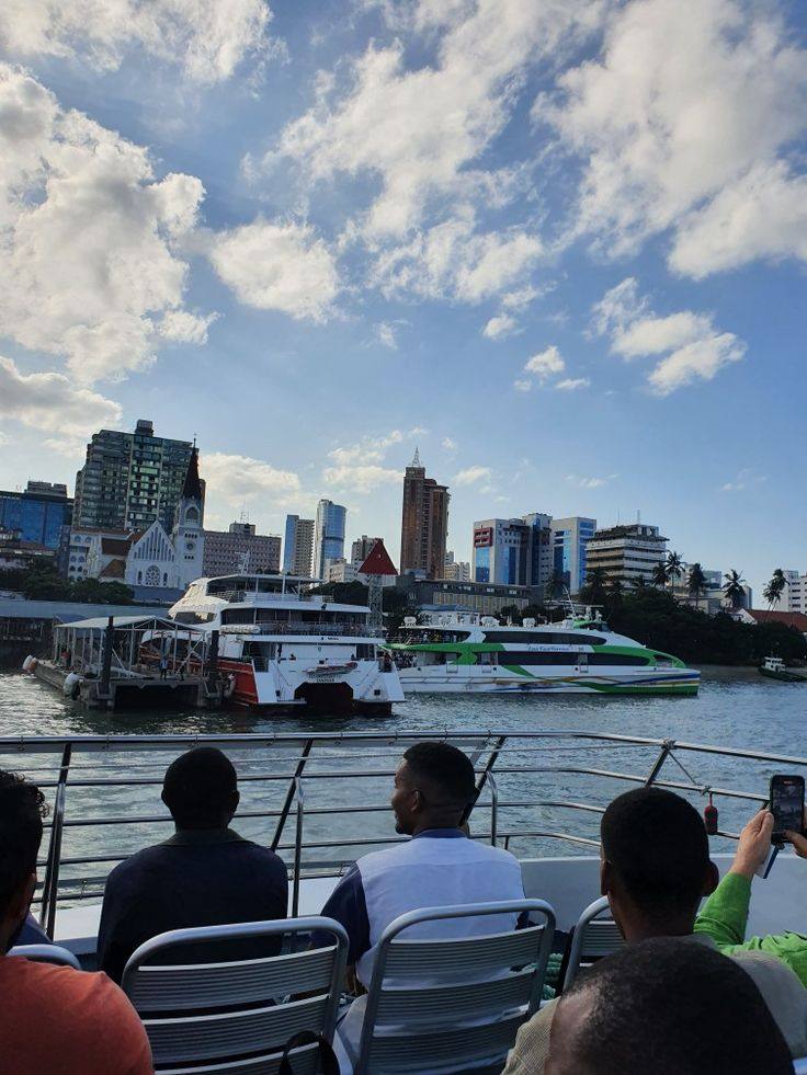 Azam Marine ferries at Dar es Salaam port with city skyline
