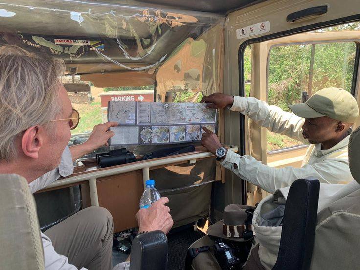 Safari guide briefing with map