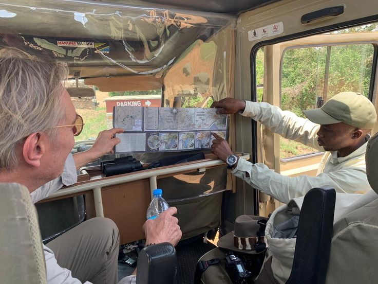 Safari guide briefing with map