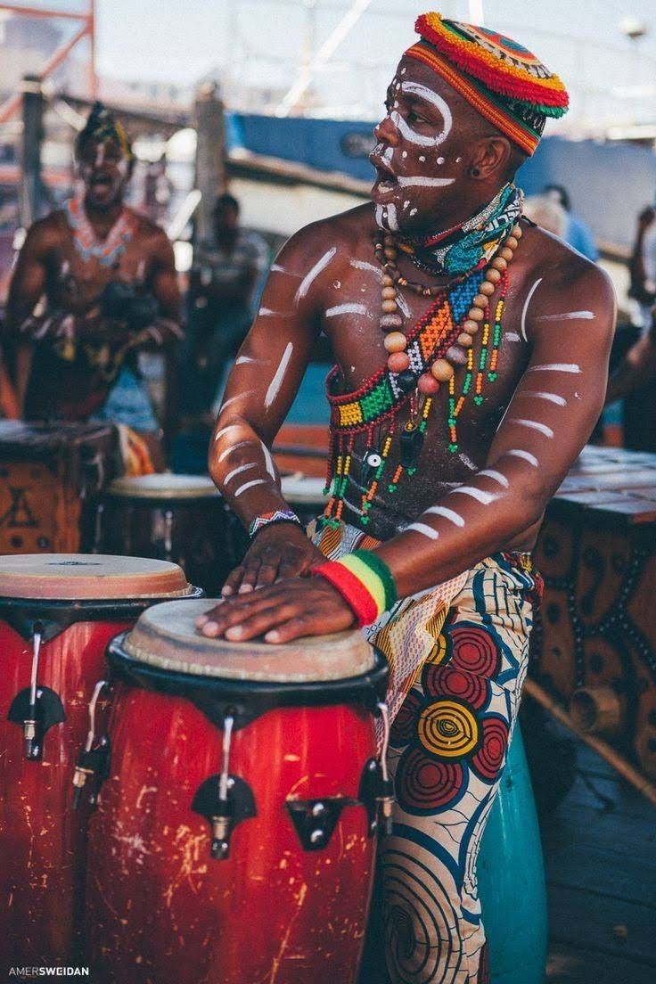Painted drummer performing at Sauti za Busara festival